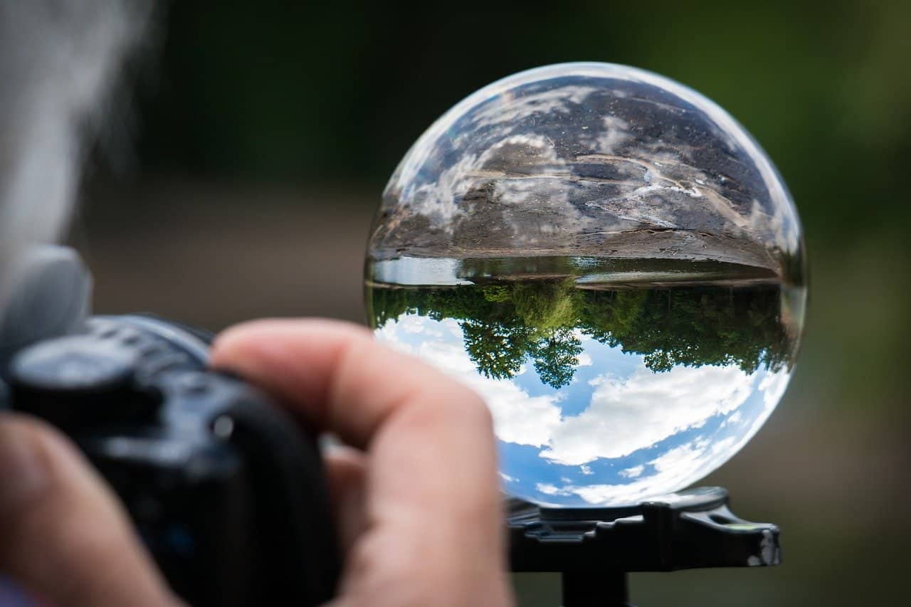 photographer shooting glass ball