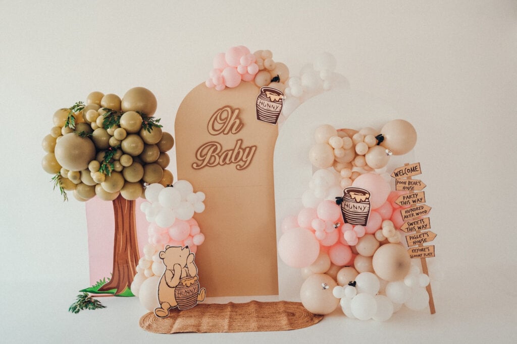 Winnie-the-Pooh decor in neutral and pink tones