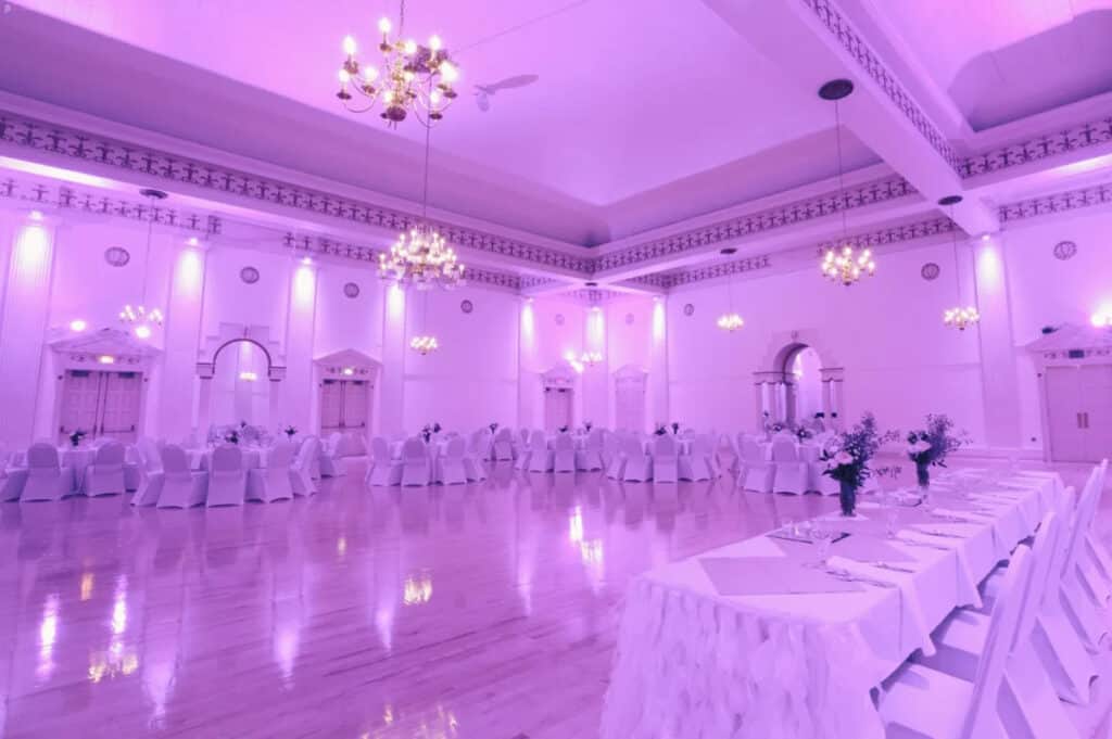 a massive ballroom with lavender hue