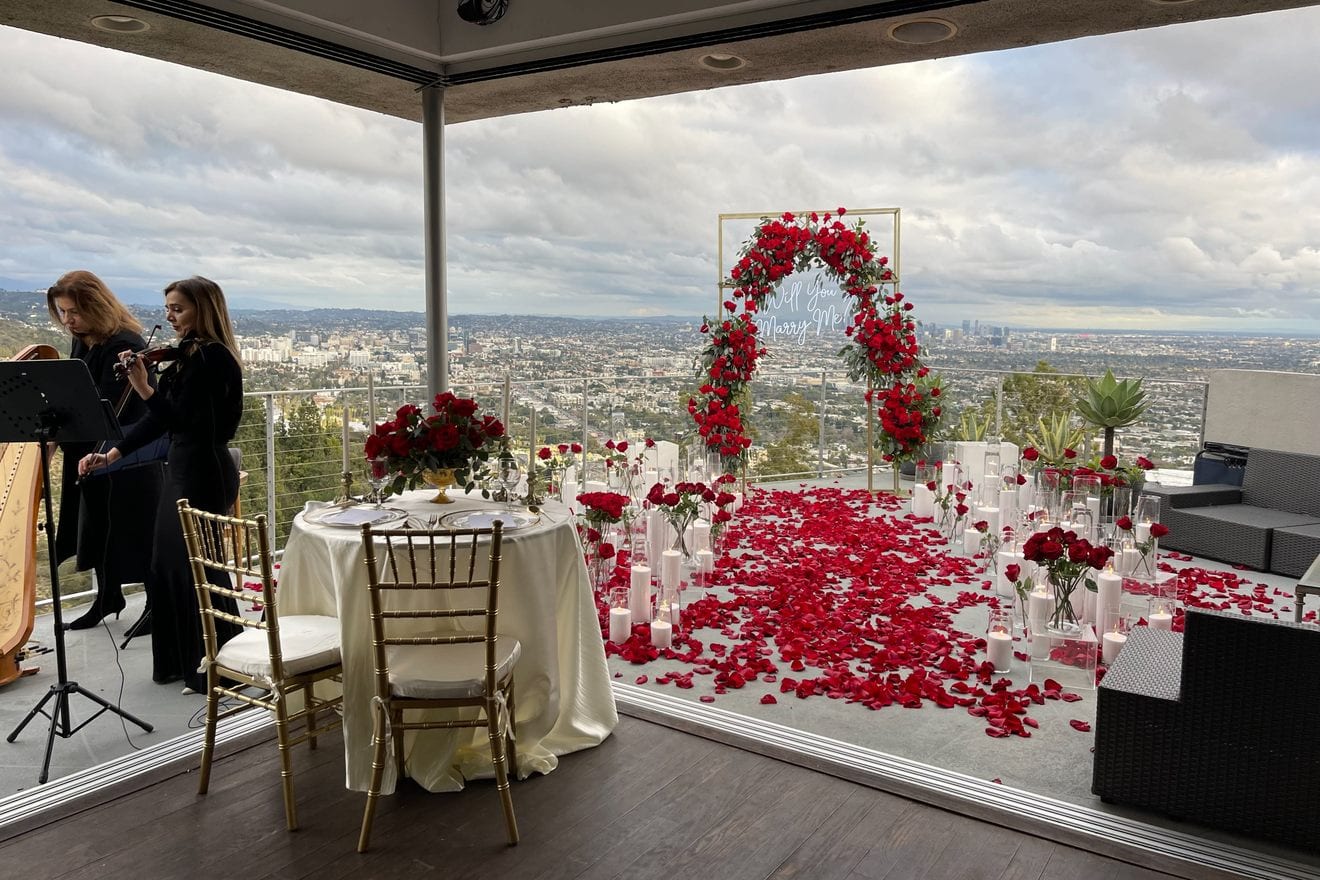 Proposal planner styling flowers and signage for a Dallas surprise