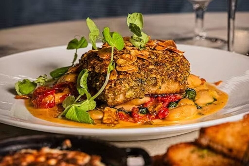 A rich entree plated on a white platter