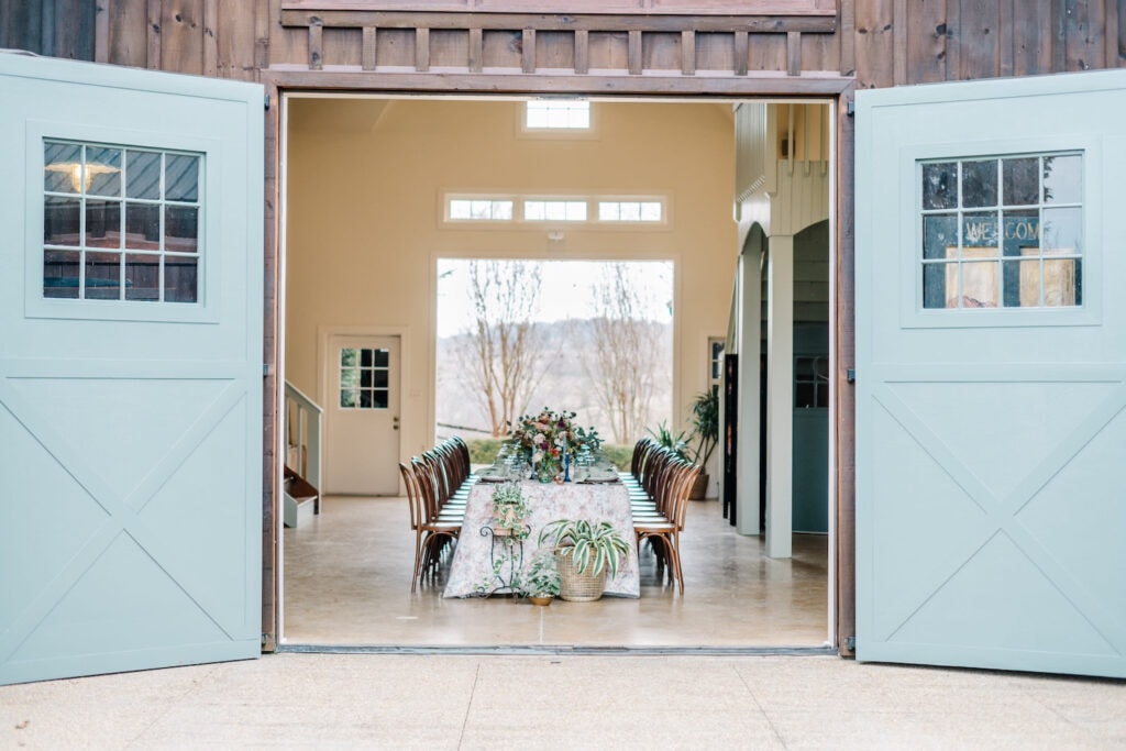 Reception space framed by giant blue barn doors