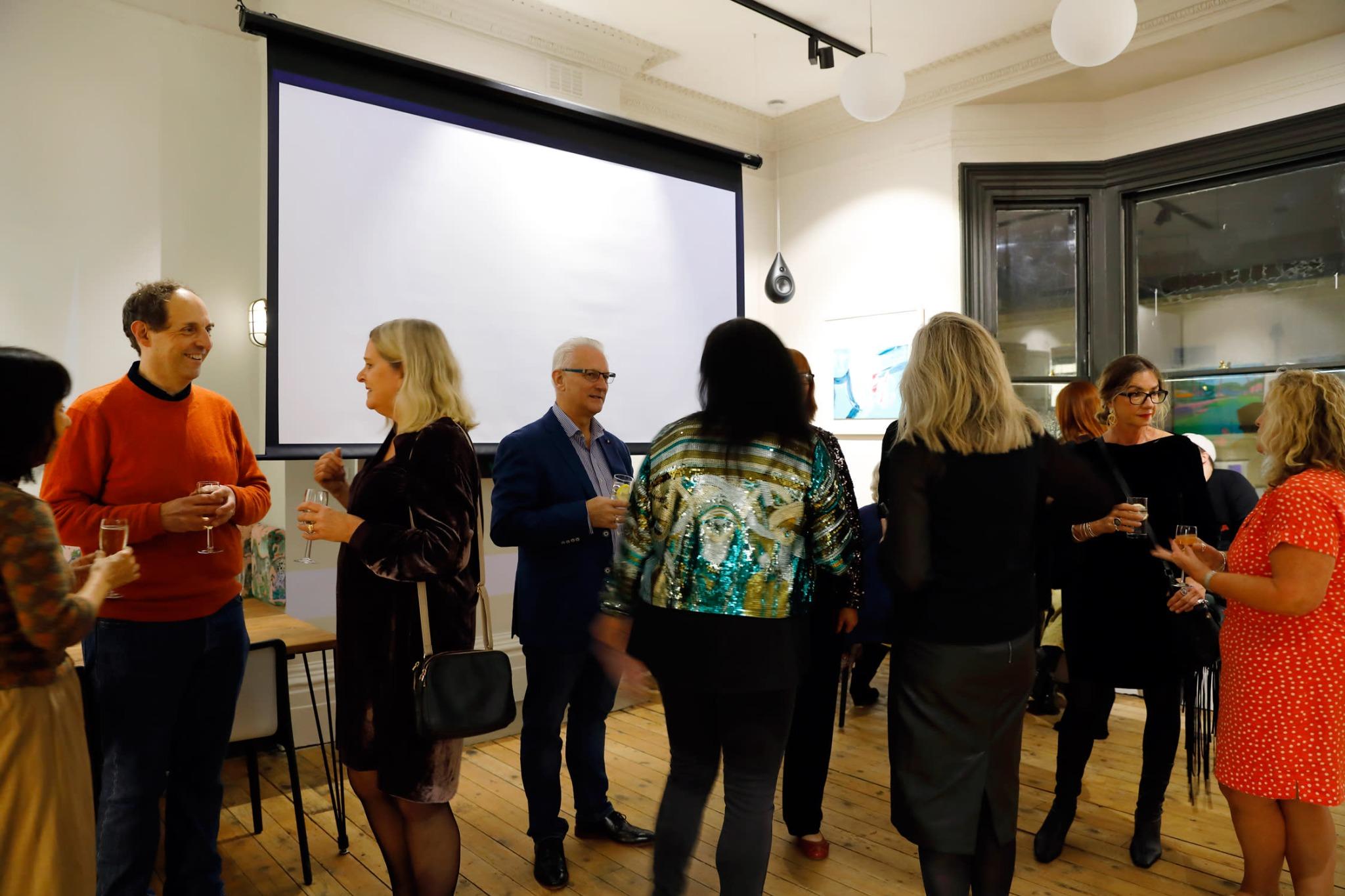 A retirement party planner arranging decor at a New York venue