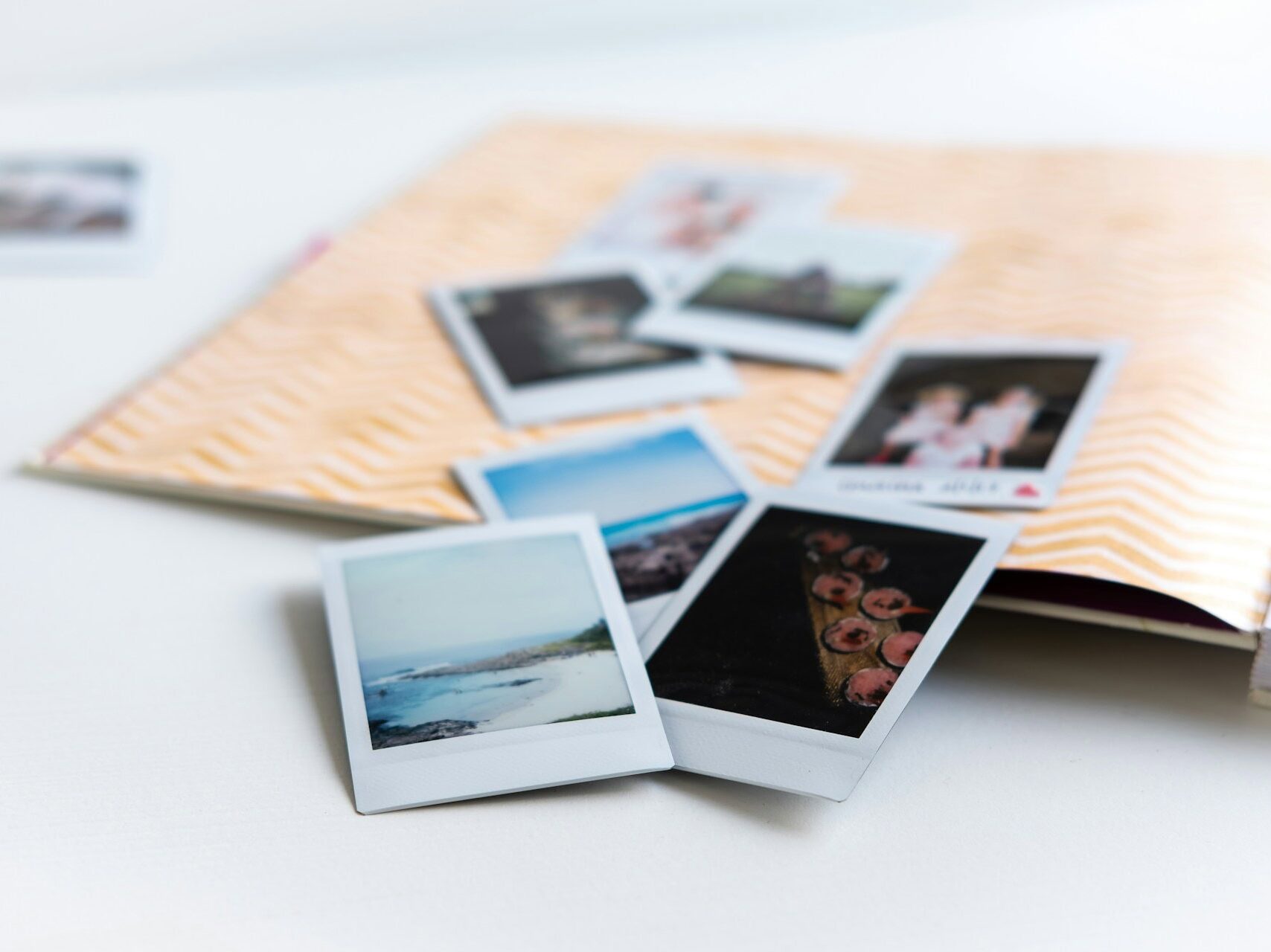 Polaroid photos on top of an open book for dad birthday idea