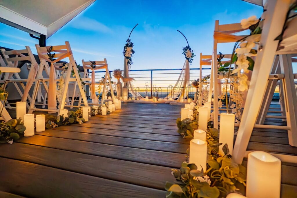 Candlelit wedding ceremony at sunset on a Denver rooftop