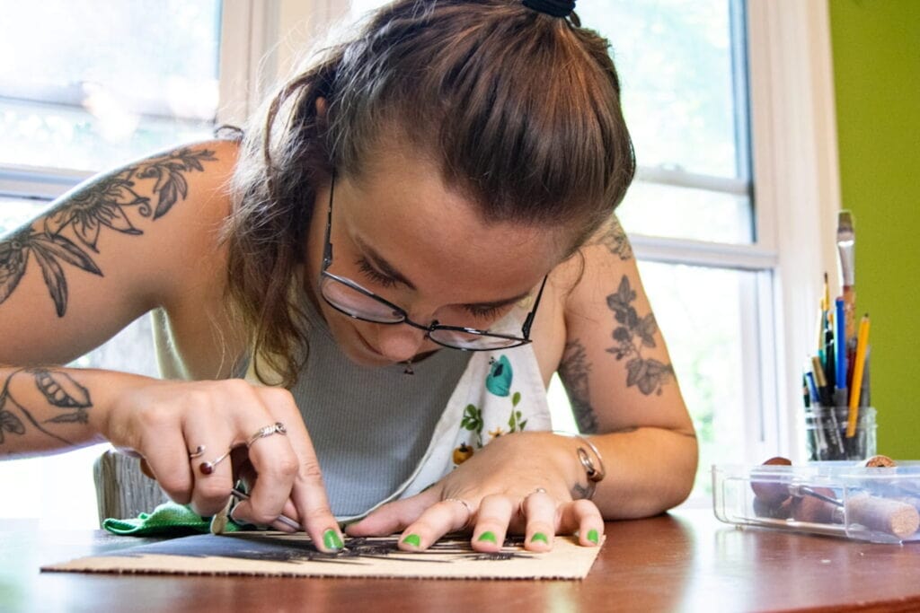 Close up of a woman working on an art project