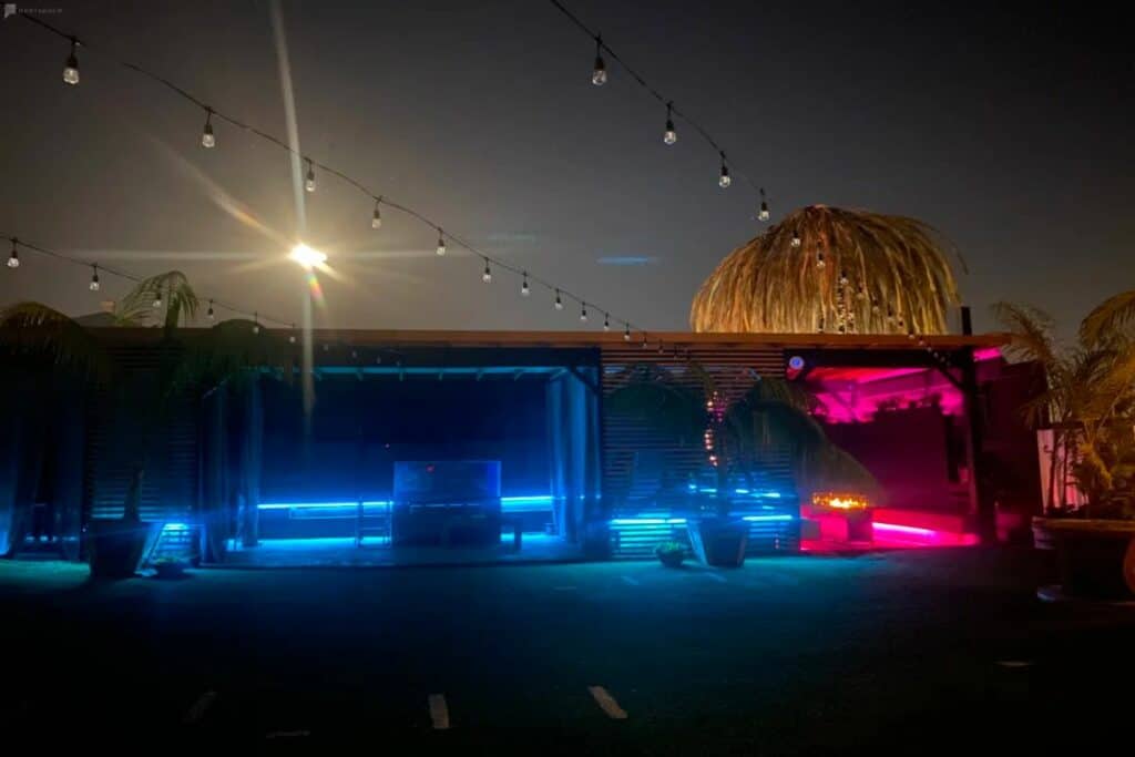 an outdoor party spot with color changing lights