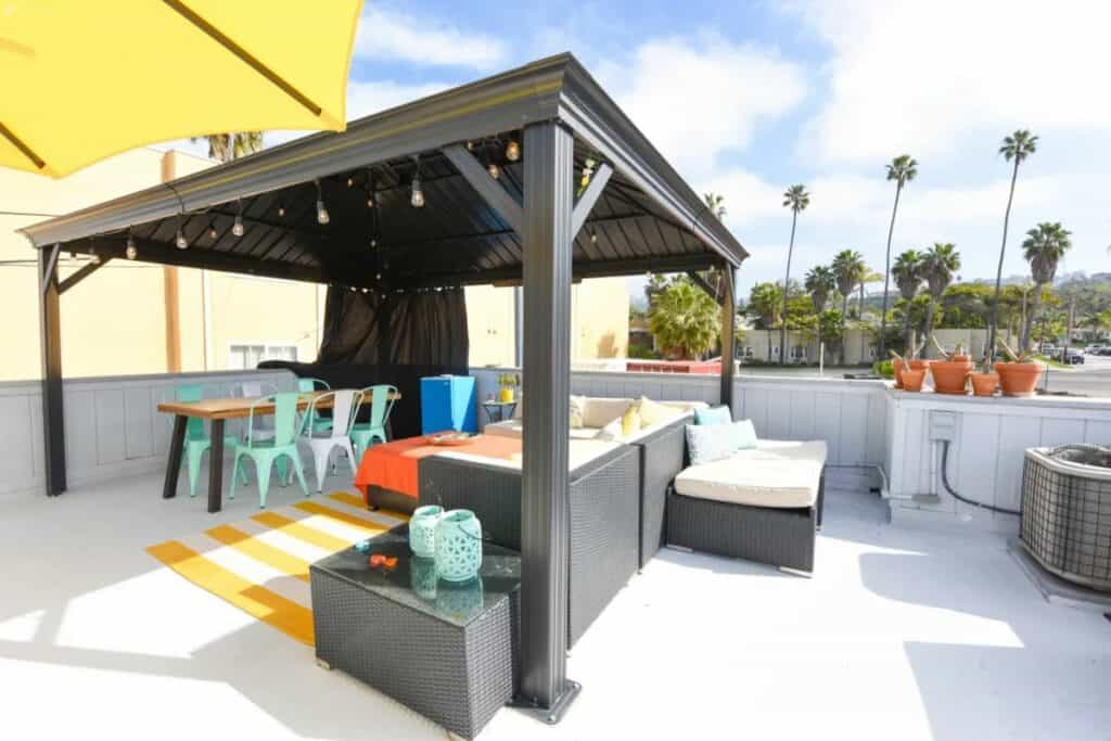 colorful rooftop deck with cozy seating