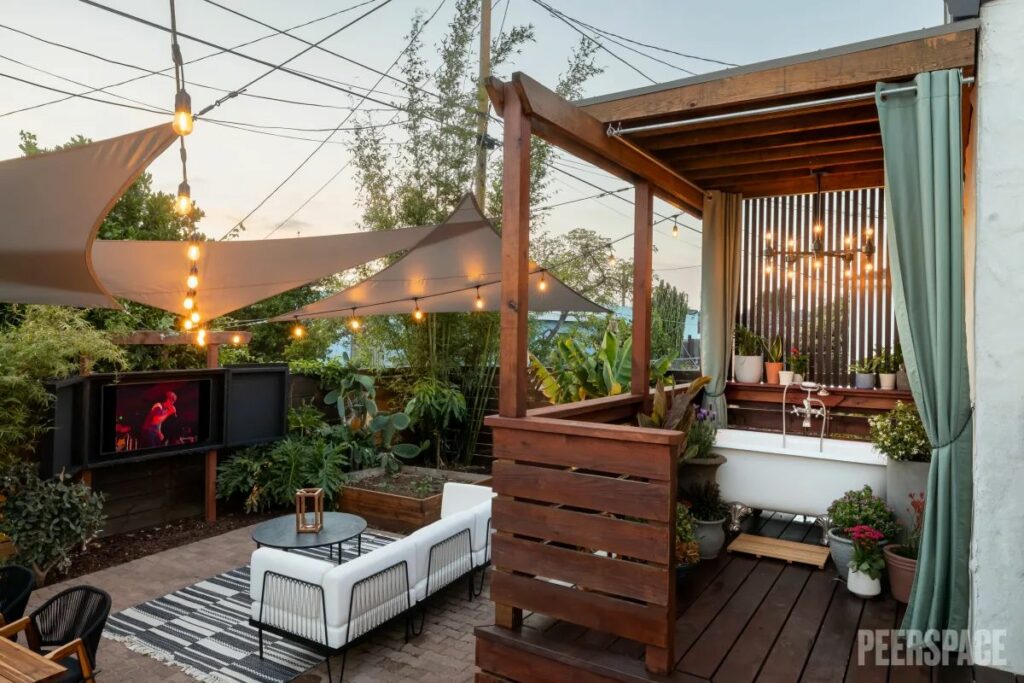 panish Style Home, tropical vibe, Outside Chandelier with Clawfoot Bathtub