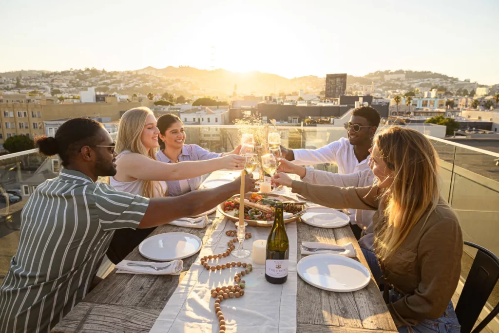 A team enjoying a meal on a rooftop venue