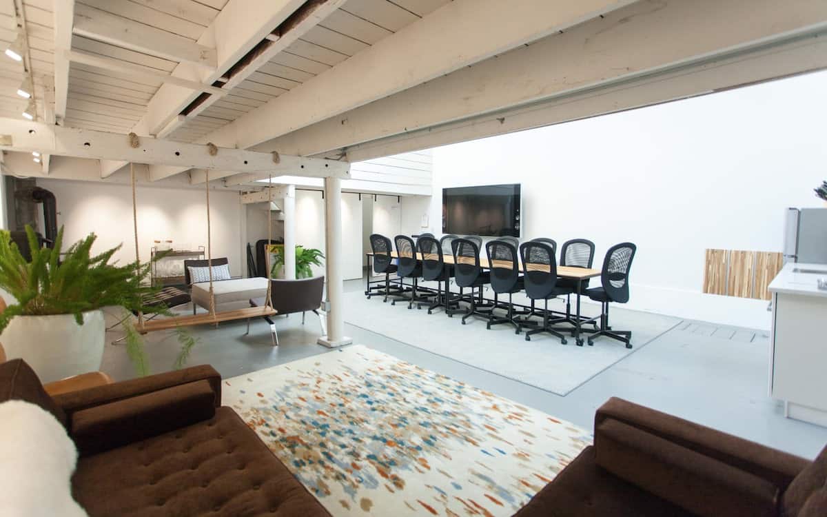 Multipurpose space for rent in San Francisco with conference tables, swing and couch