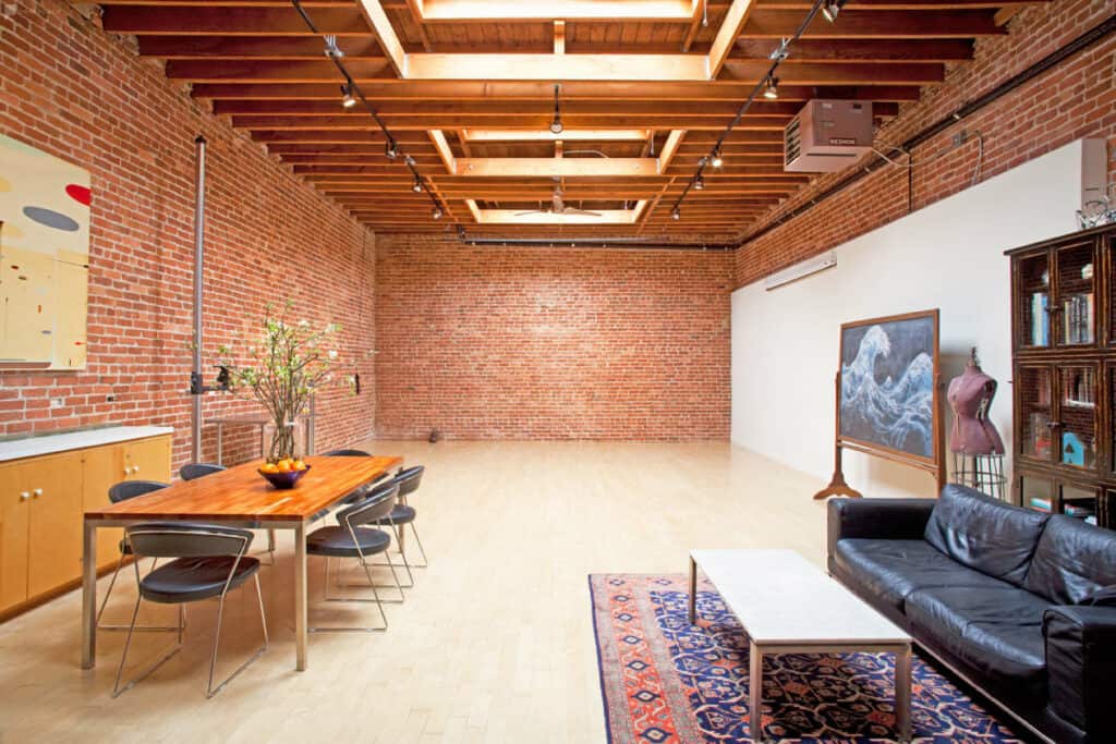 photo studio with brick wall and breakout space