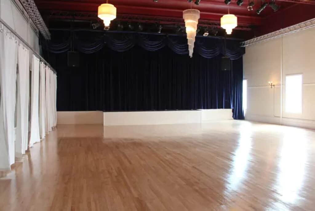 Bright 2500 sf space with wood floors a stage