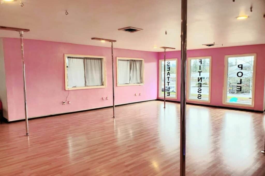 pink dance studio with poles