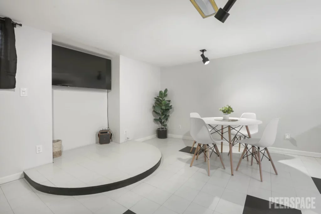 an all-white karaoke bar in a home