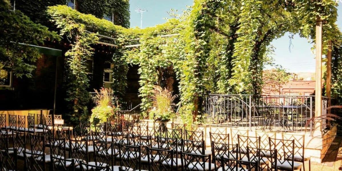 outdoor venue with pergola and greenery