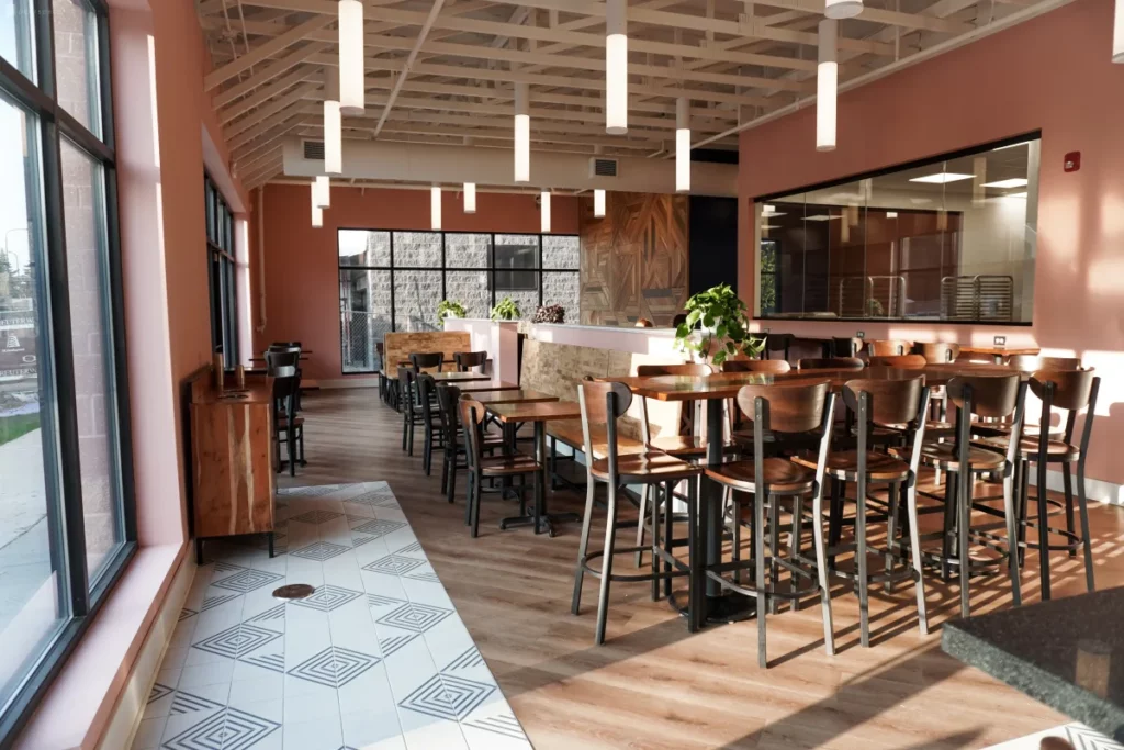 Restaurant Dining Room with Pastel Pink Walls & Custom Wood