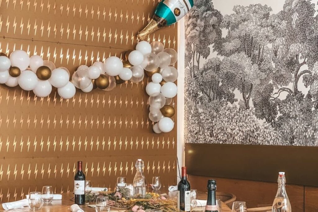 event space with balloons and backdrops