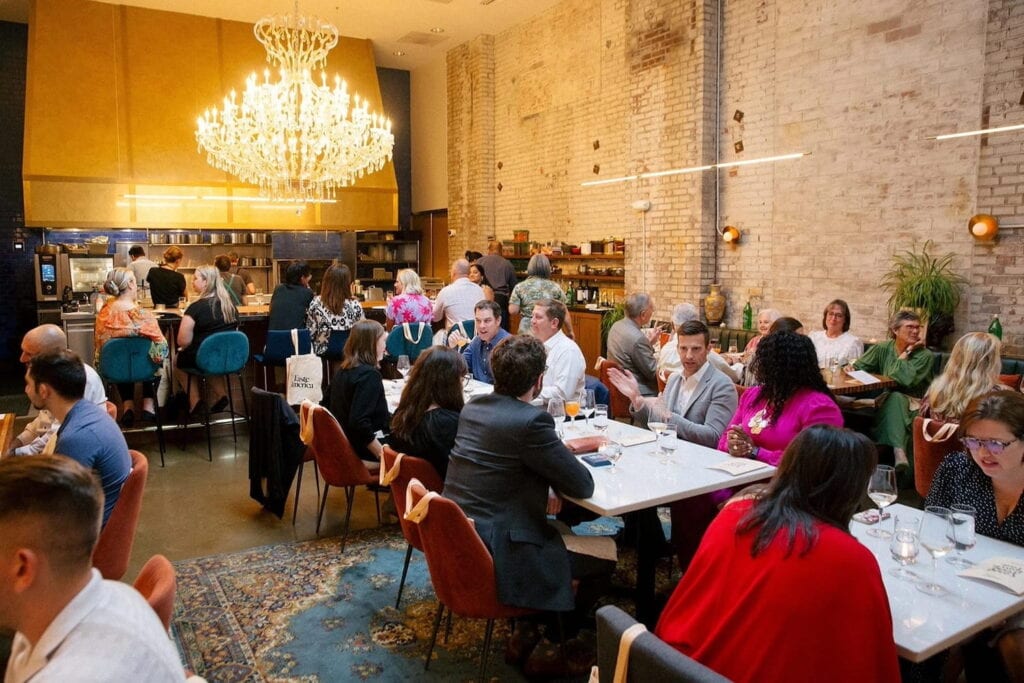 Interior shot of a full dining room and bar at Tailor Nashville