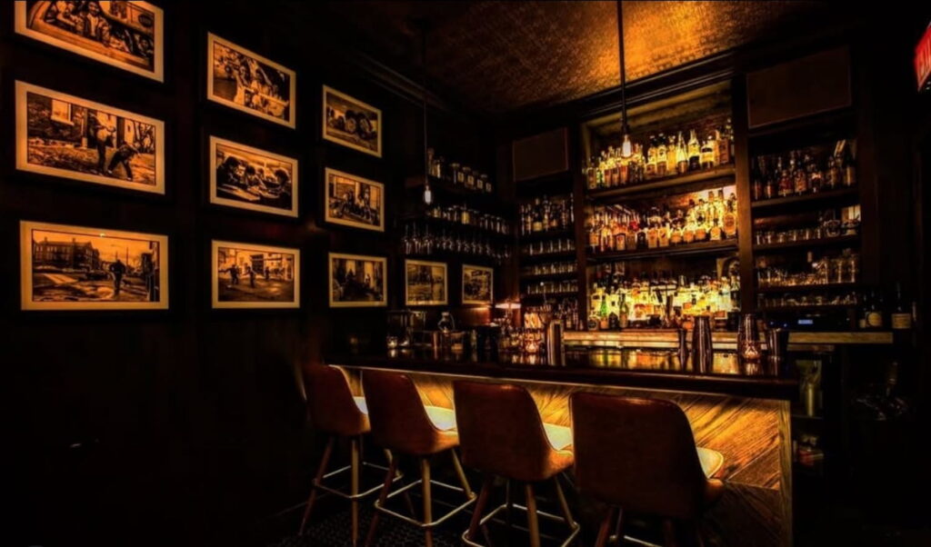Dim lights illuminate a small bar at The Alderman in Chicago