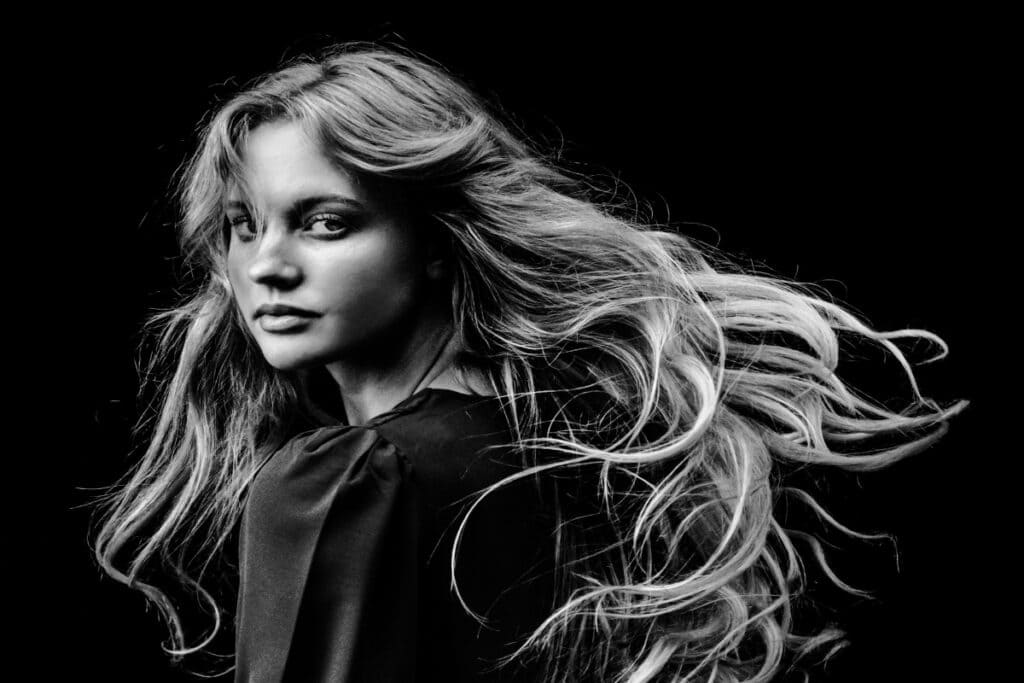 black and white photo of woman with long hair