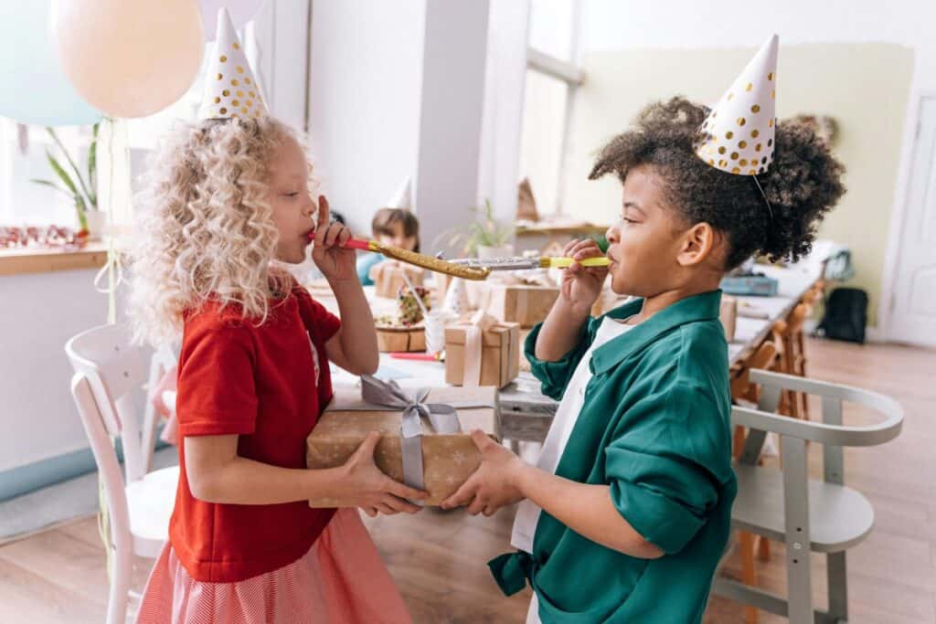 two little girls playing at a birthday party