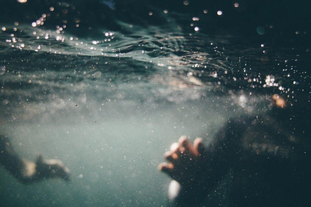 underwater photograph of people water photography