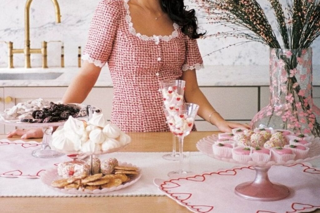 a woman with decorated cookies for valentine's day