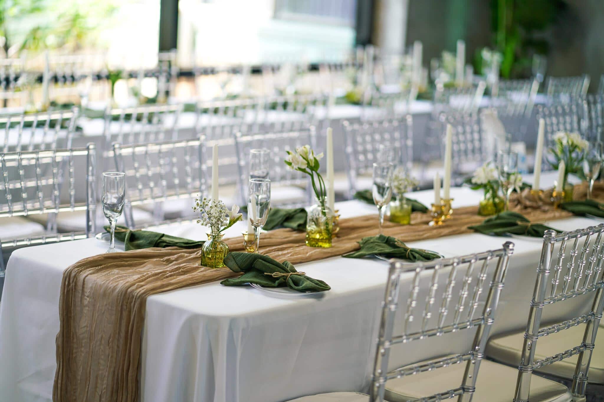 Wedding florist setting up arrangements at a Minneapolis venue