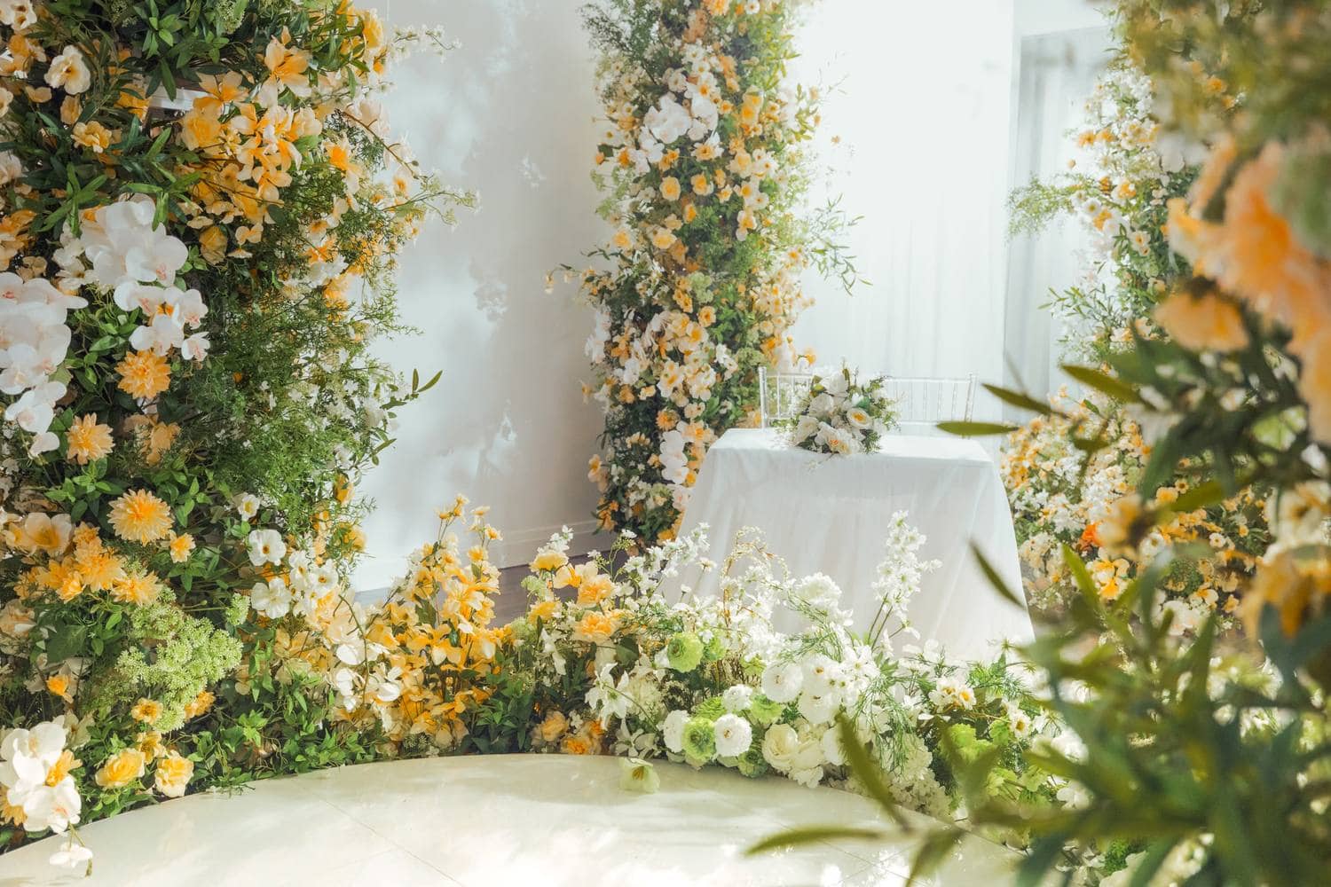 Florist-designed wedding arrangements on display at a Tampa event space
