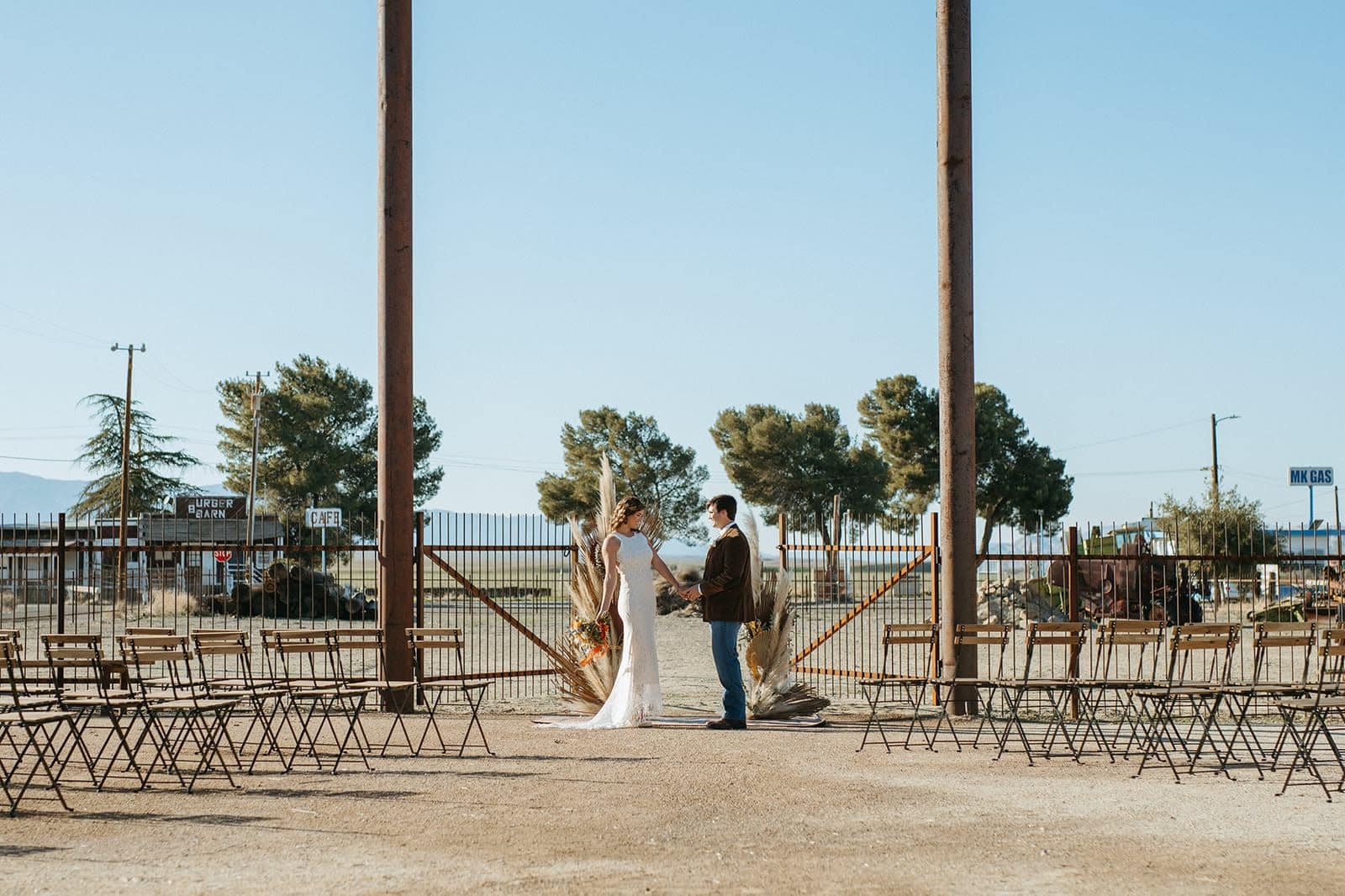 Outdoor wedding ceremony setup with pine trees in rural Albuquerque