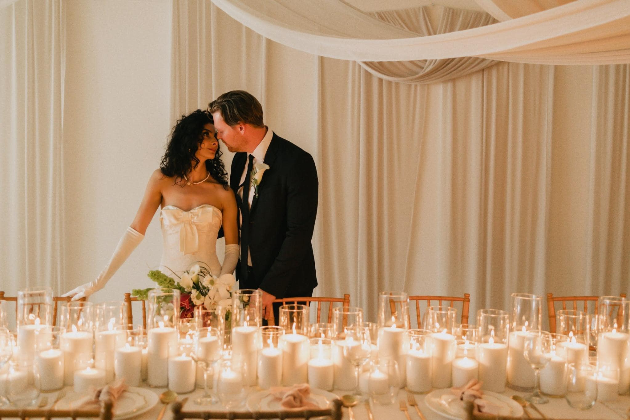 Bride and groom at candlelit Bakersfield wedding reception table