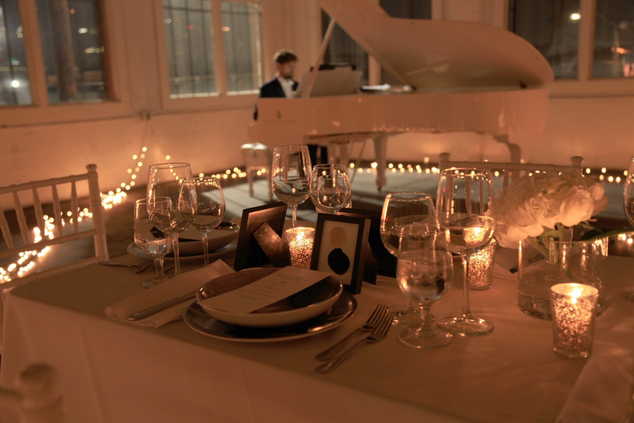 Candlelit reception table with elegant place settings for Beverly Hills wedding