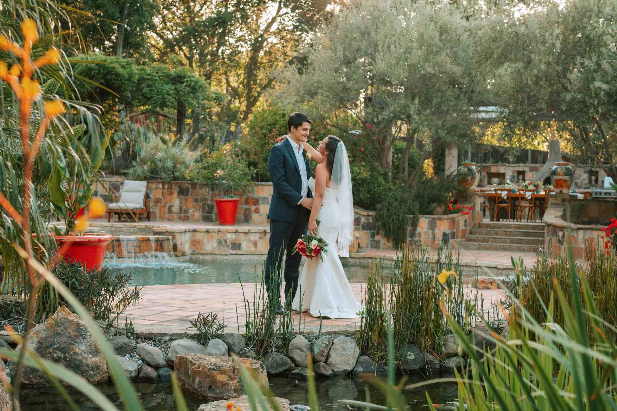 Bride and groom in Mediterranean garden venue for Beverly Hills wedding