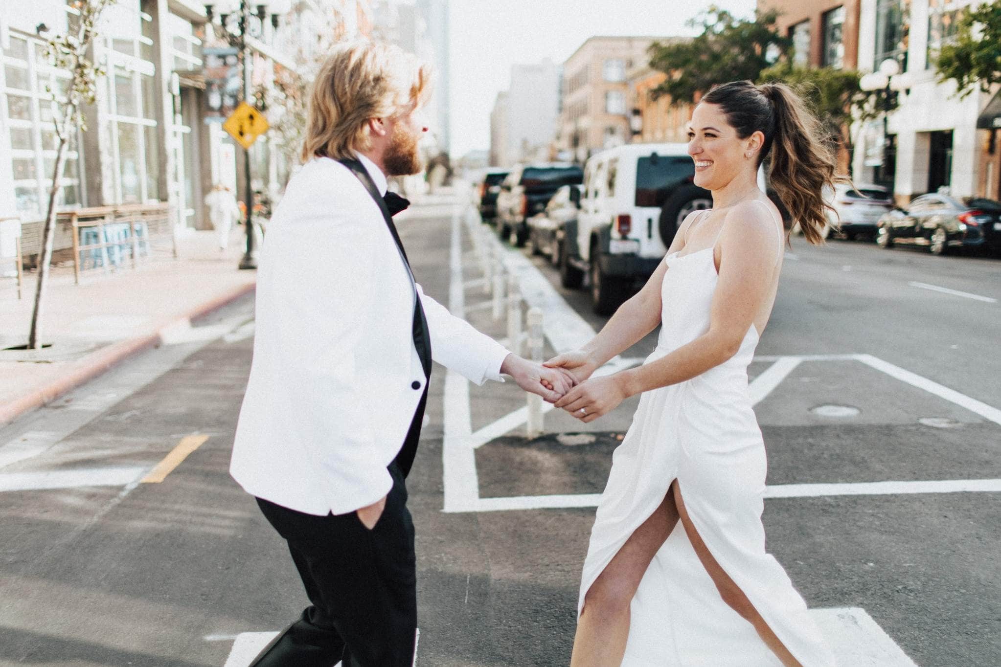 Stylish couple posing on downtown street for Buffalo wedding photography session