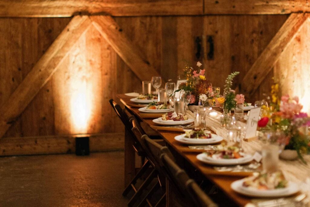 Intimate indoor dinner table setting for cozy Colorado mountain wedding reception
