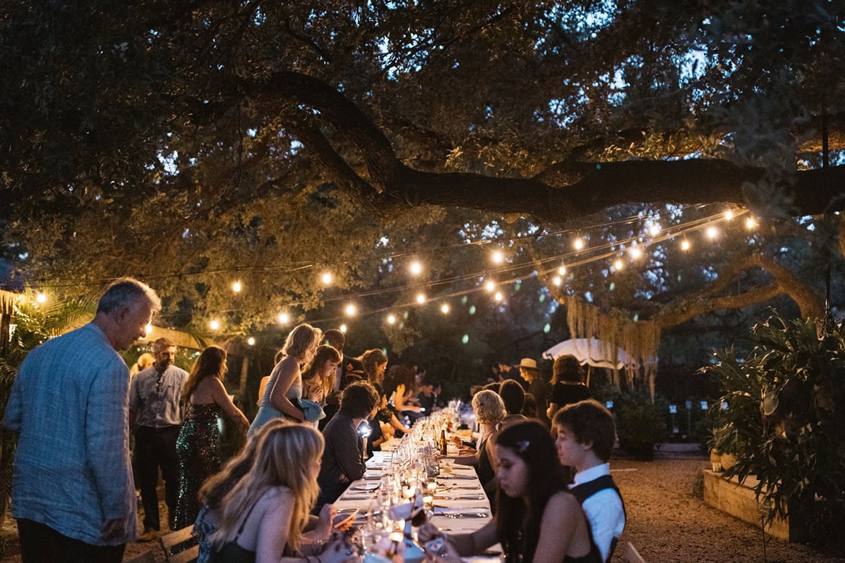 Intimate outdoor wedding dinner under string lights in Corpus Christi