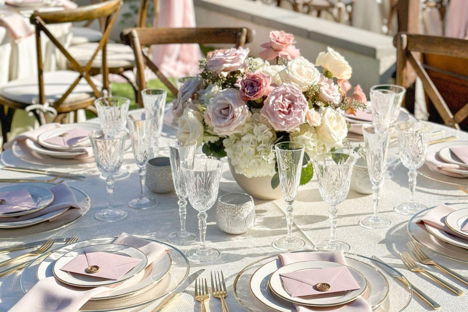 Elegant Delaware wedding reception tablescape with florals and place settings