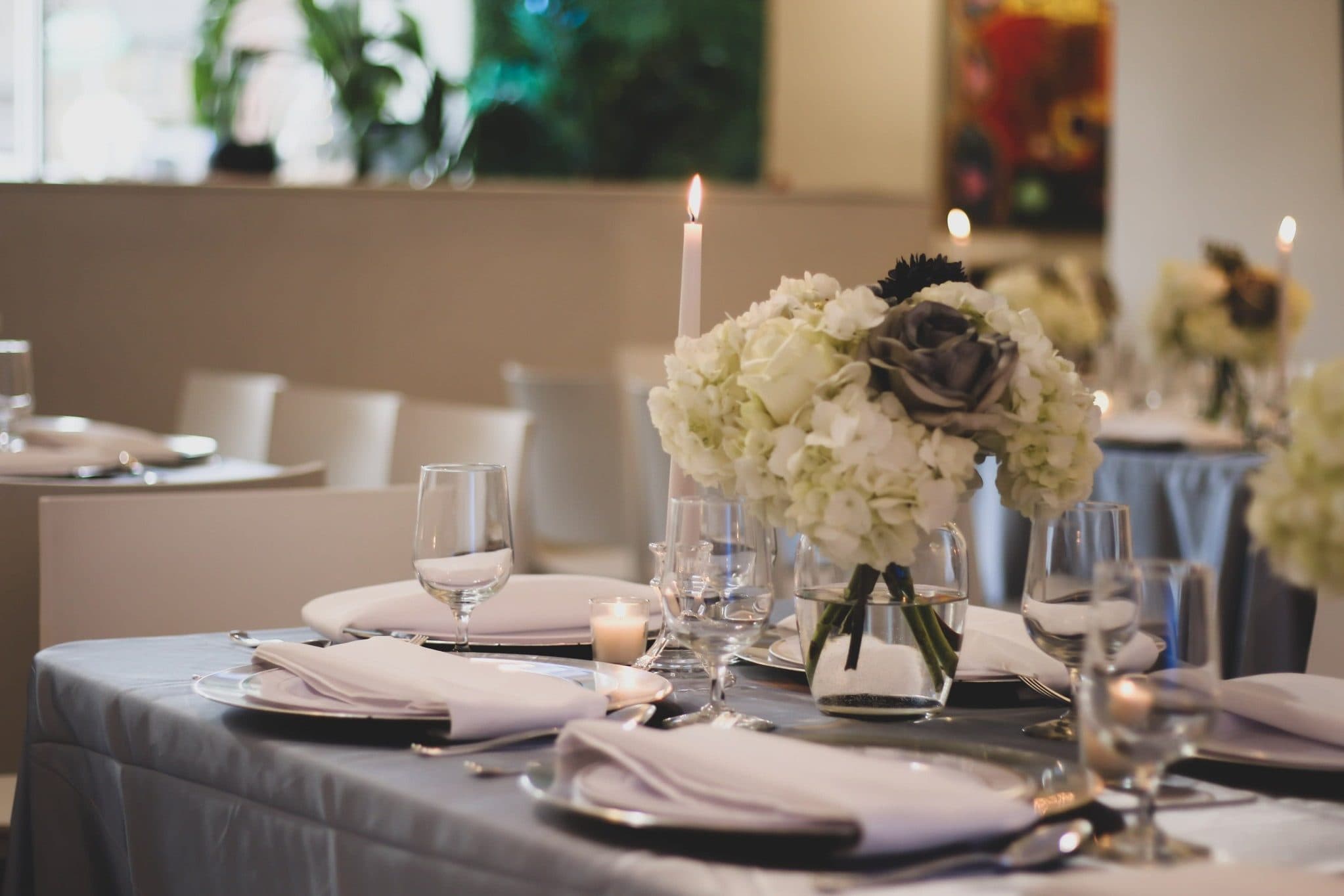 Formal Fort Wayne wedding reception table with floral centerpiece and candles