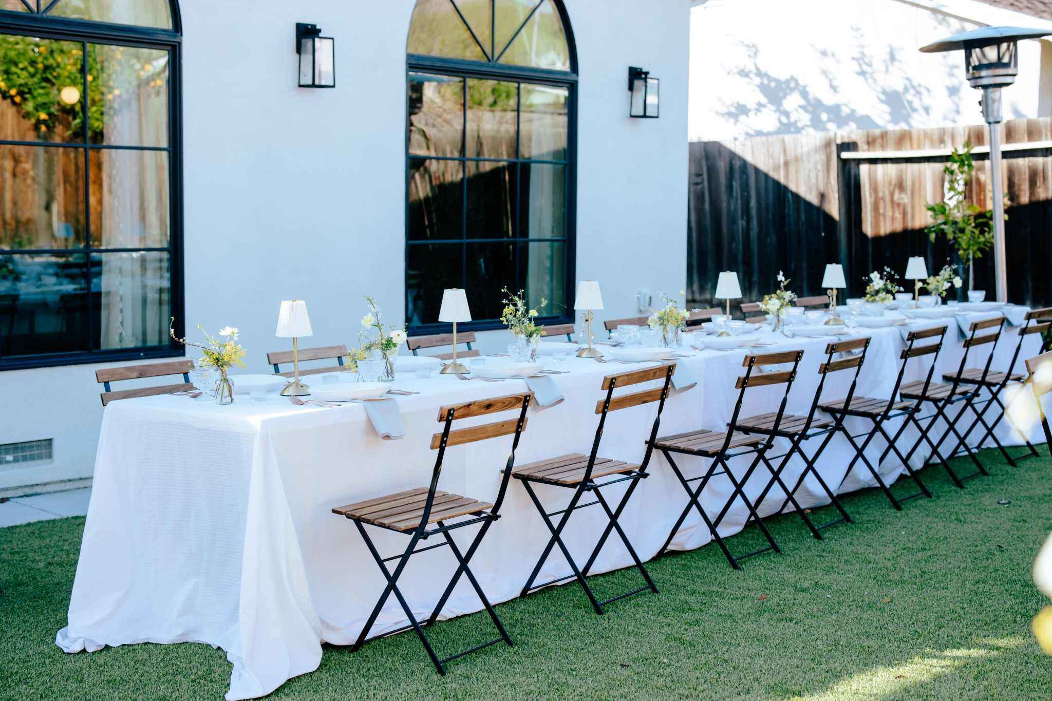 Modern outdoor Fresno wedding table setup with floral arrangements