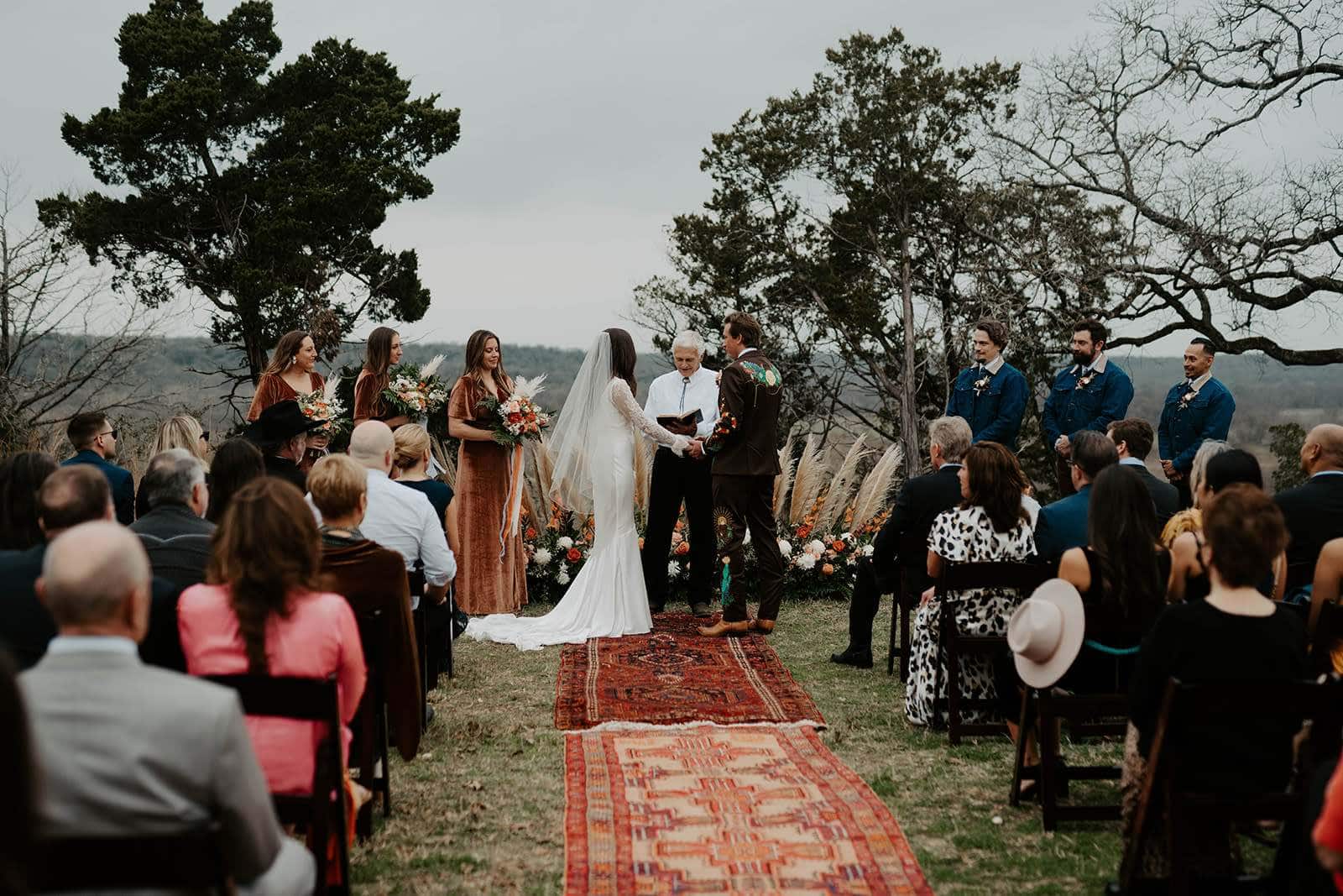 Outdoor Greensboro wedding ceremony with floral aisle and wedding party