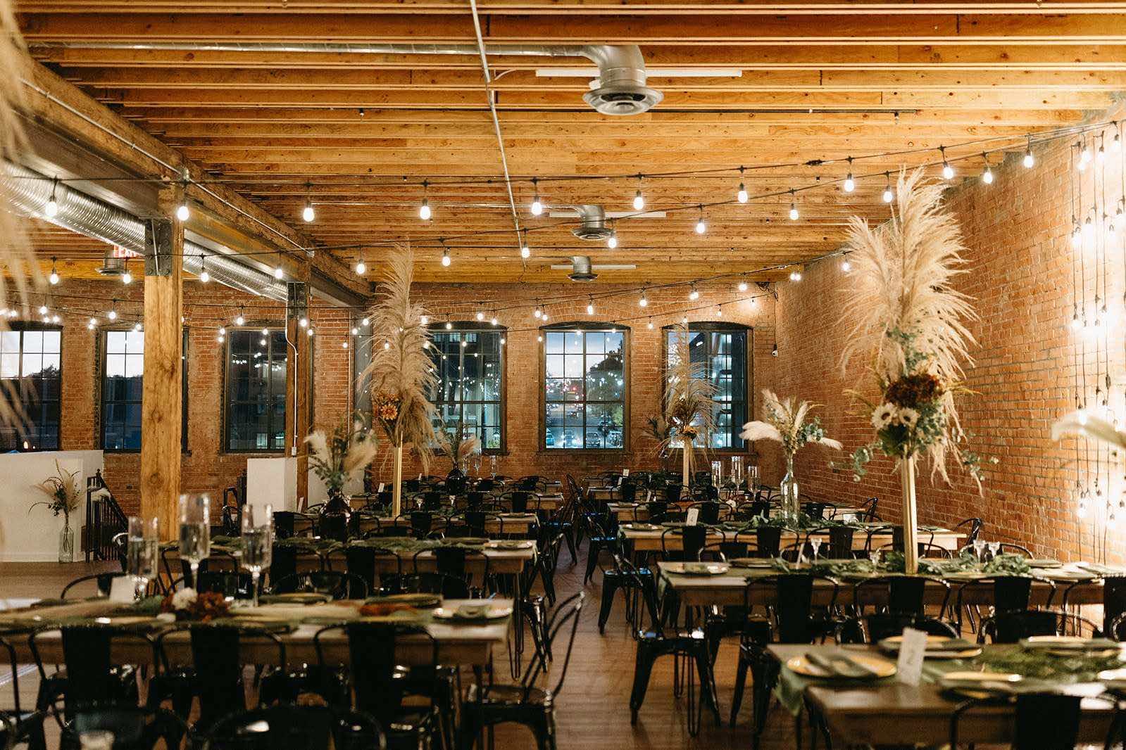 Industrial Greensboro wedding venue styled with pampas grass centerpieces