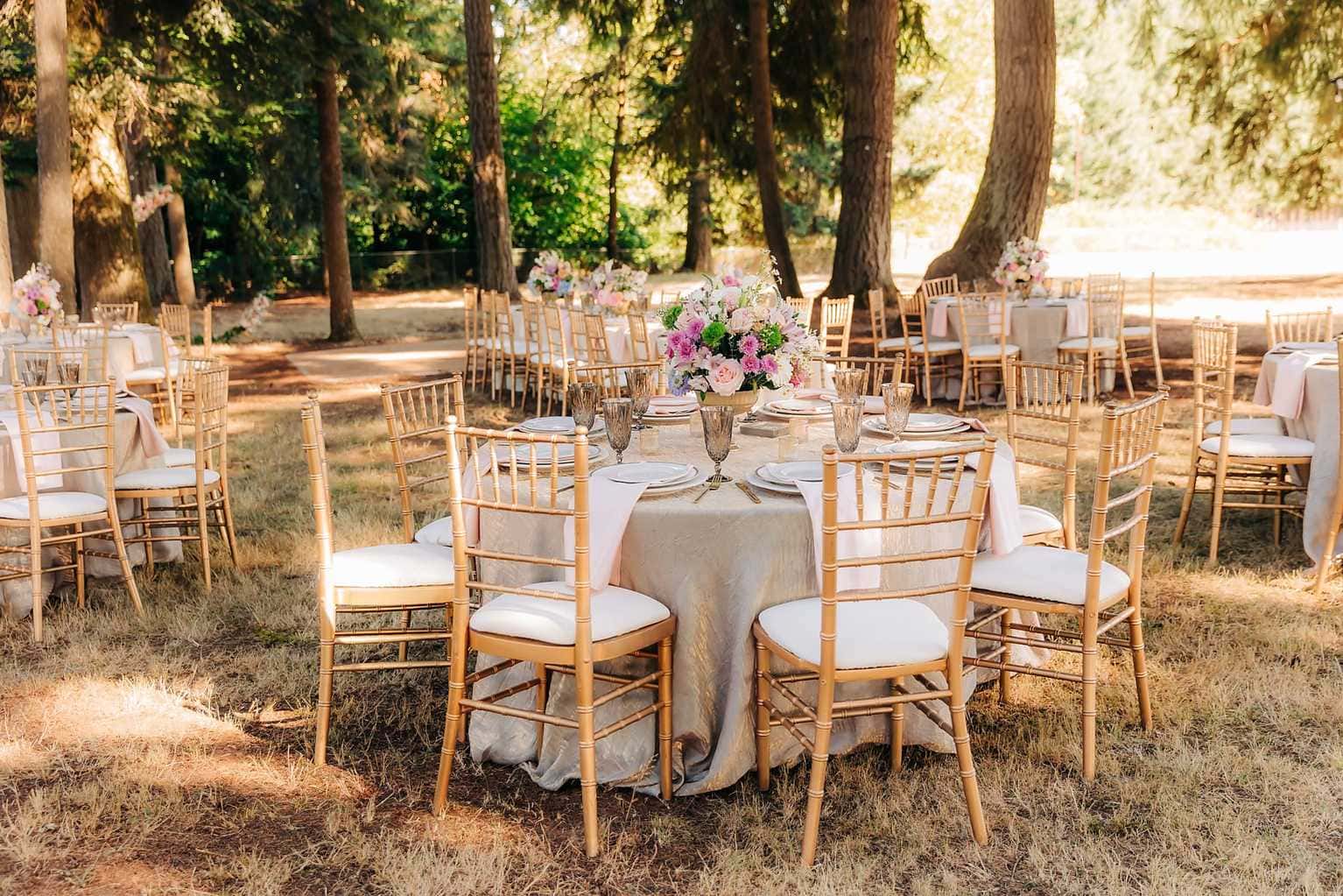 Elegant outdoor Idaho wedding reception with forest tablescape and florals