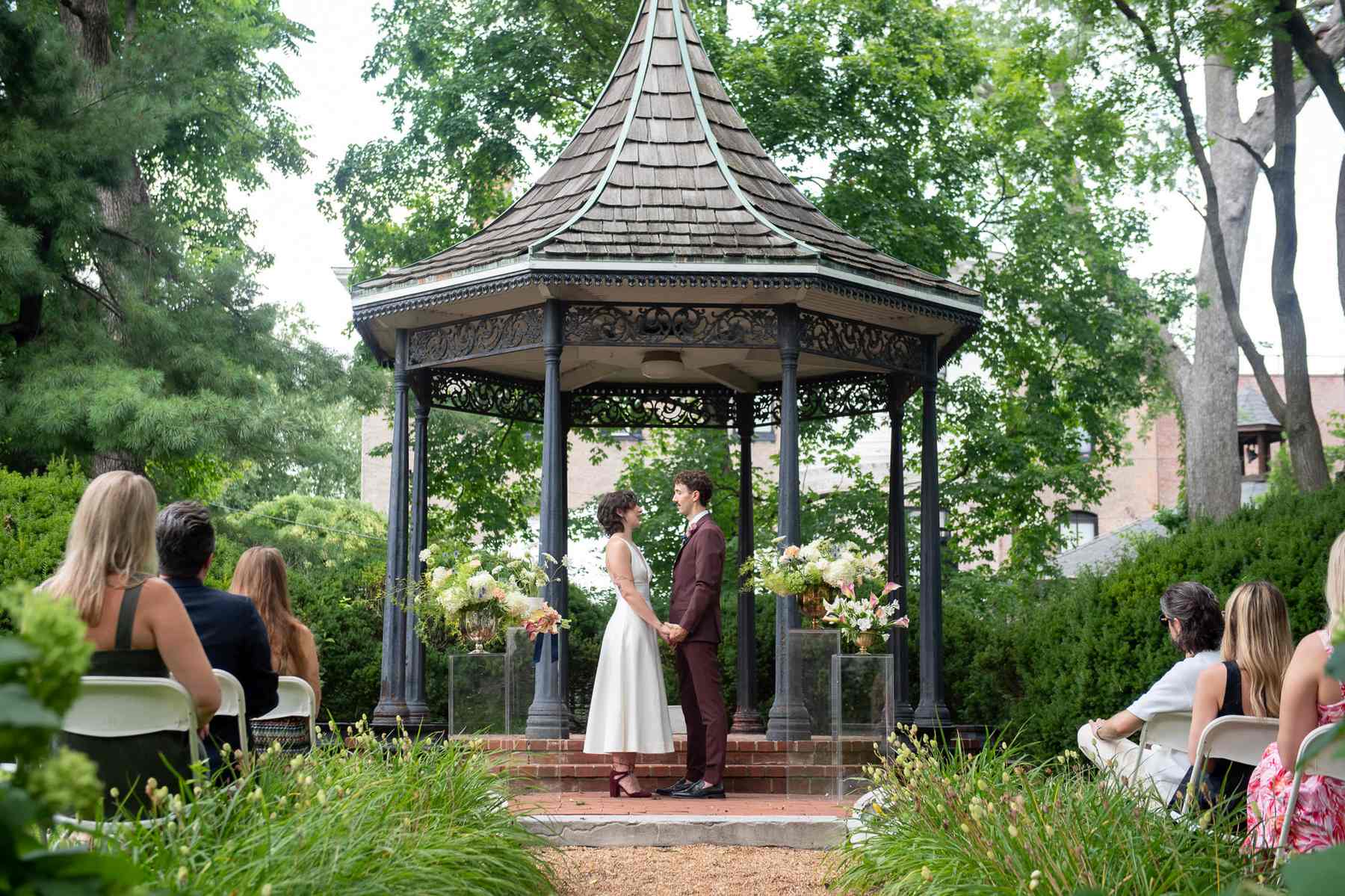 Victorian gazebo wedding ceremony with guests in Illinois garden venue