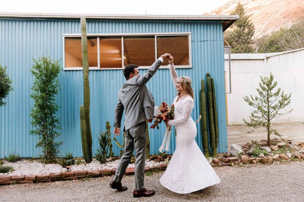 Bride and groom dancing near cacti at unique Las Vegas wedding