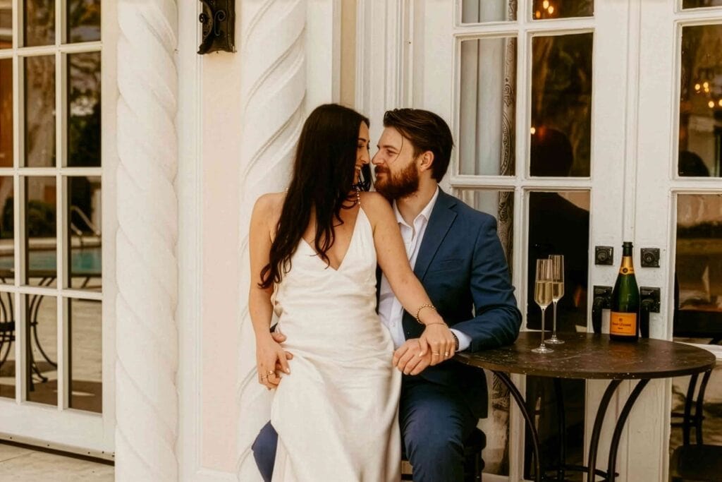 Romantic couple celebrating with champagne at intimate Las Vegas wedding event