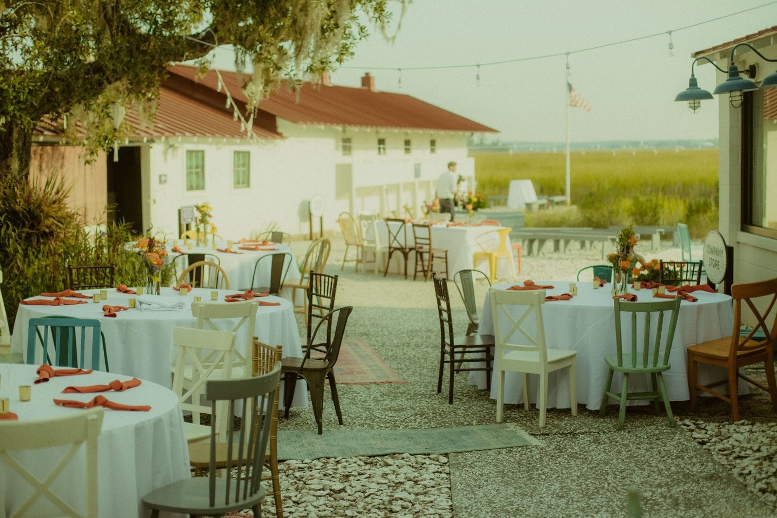 Coastal Louisiana wedding reception with open-air table settings