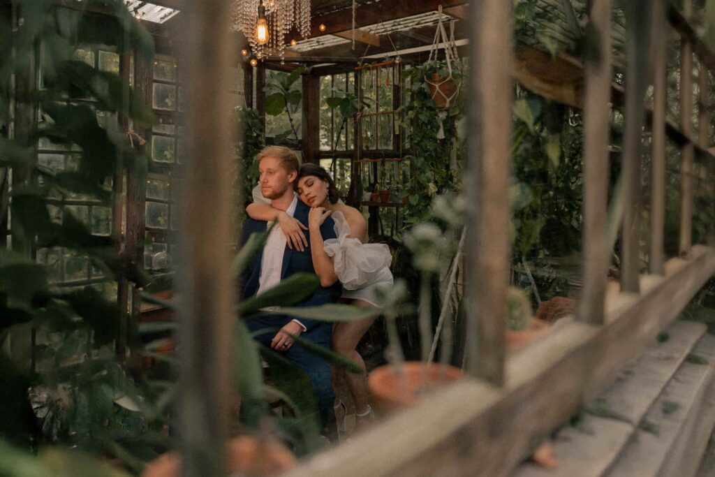 Romantic couple portrait inside a lush Maryland greenhouse wedding venue