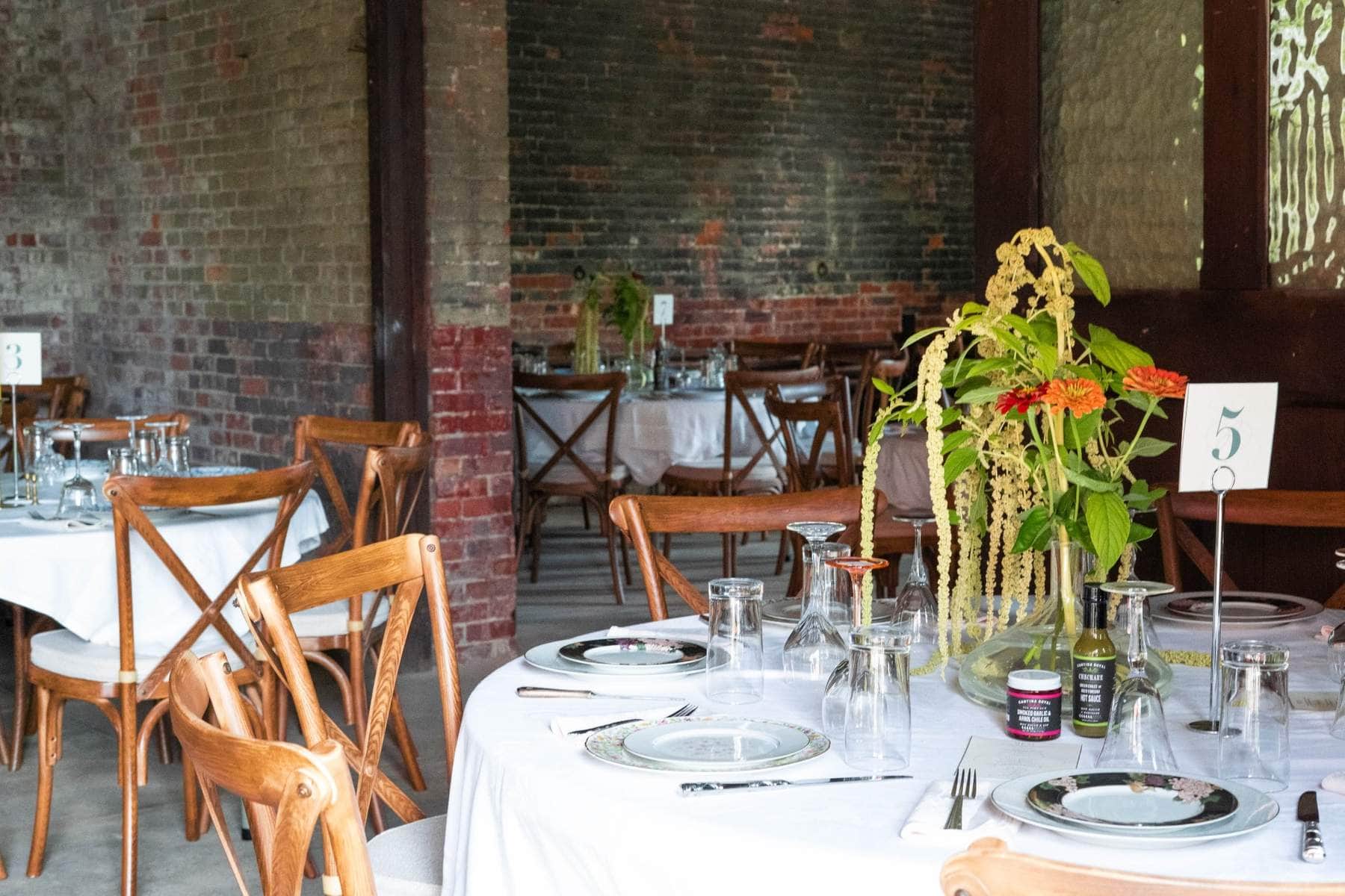 Massachusetts wedding reception table with floral centerpiece and numbered settings