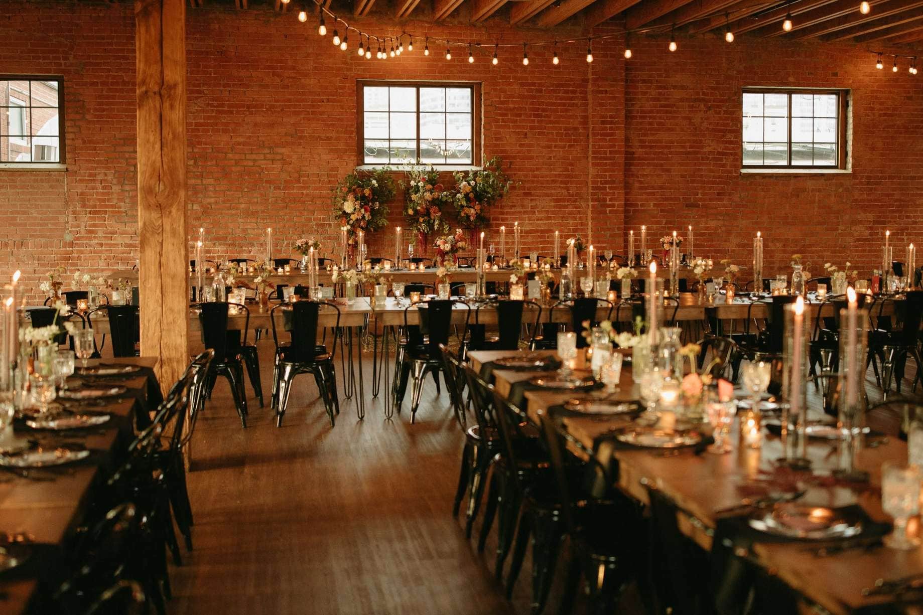 Elegant Milwaukee reception space with exposed brick and string lights